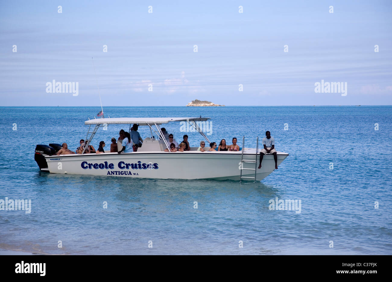 Creole Cruise with tourists on Dickenson Bay Stock Photo