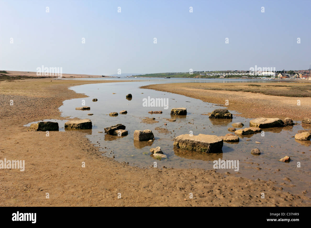 Stepping stones across the fleet lagoon at Chesil beach Weymouth Dorset