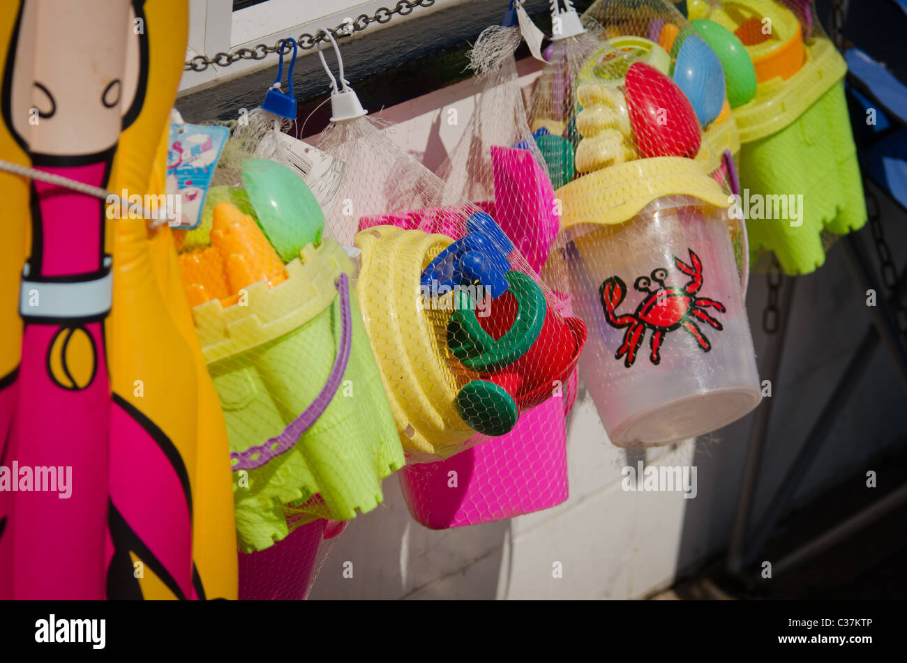 Buckets and spades outside shop Stock Photo Alamy