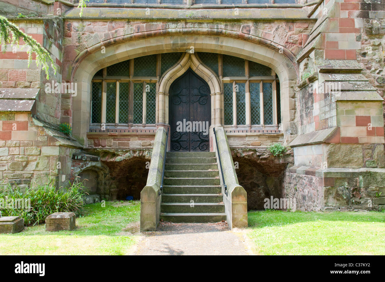 East door at Malvern Priory Stock Photo