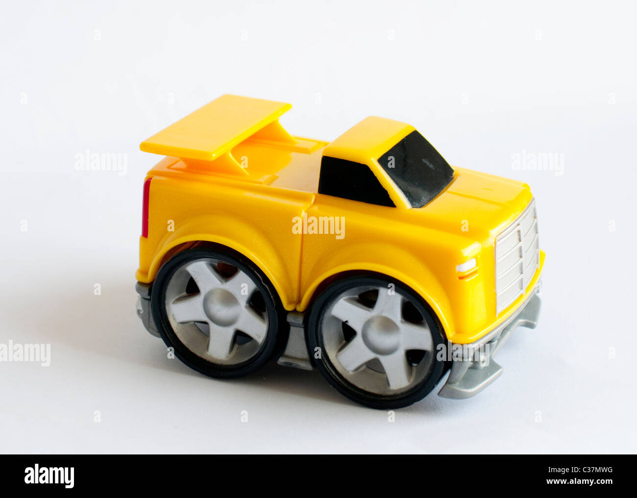 A yellow toy car isolated on white background Stock Photo Alamy
