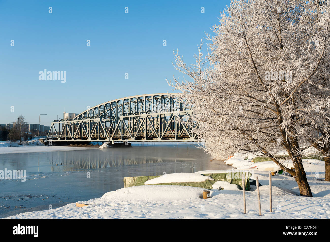 Bridge over the river Oulu in a cold winter day in Oulu, Finland Stock Photo