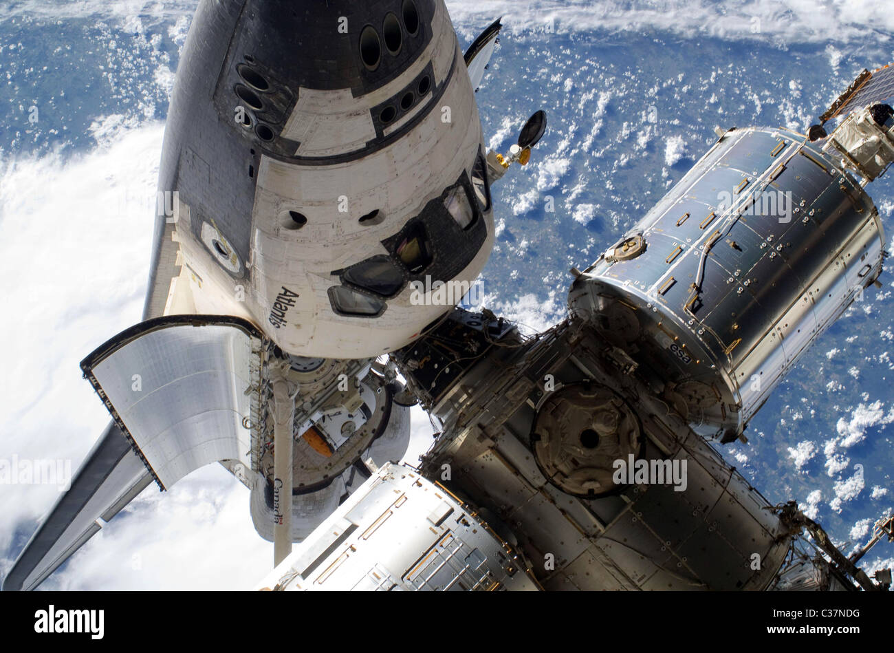Space shuttle Atlantis docked with the International Space Station ...