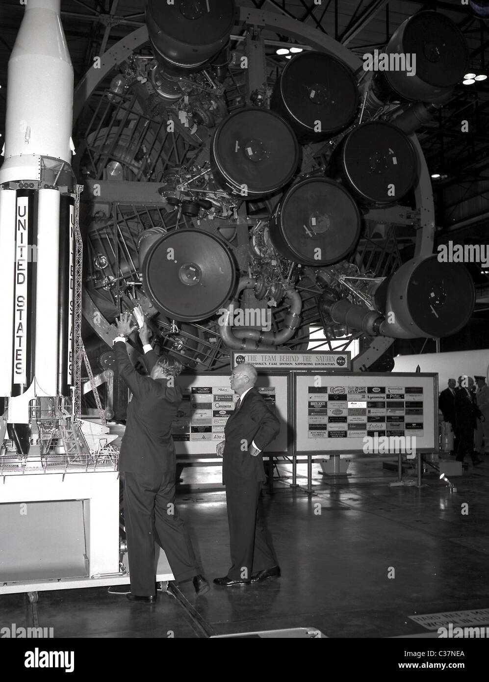 Dr. Werhner von Braun showing the first stage of the Saturn rocket to President Dwight D. Eisenhower. Stock Photo