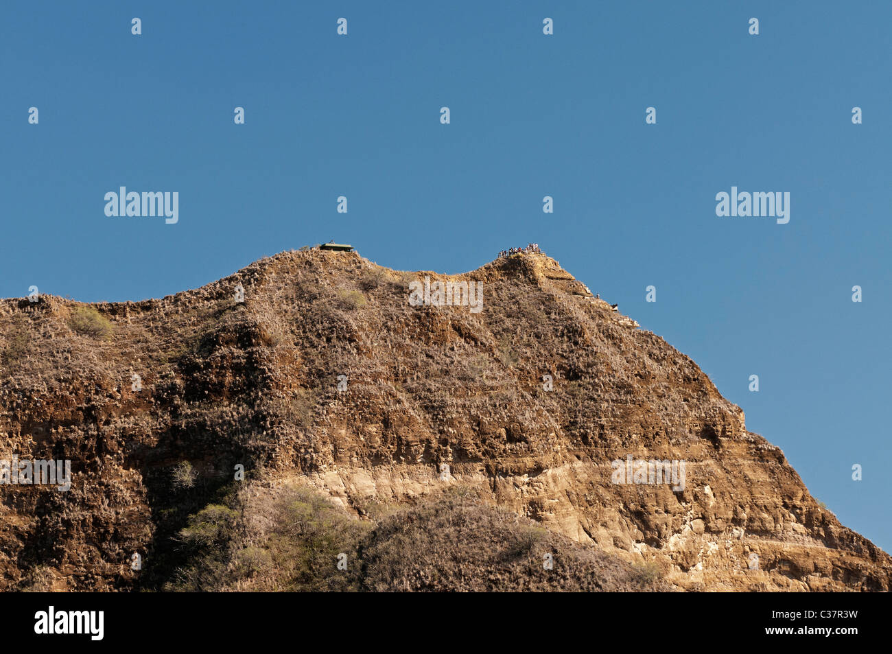 Diamond Head, a tuff cone volcanic crater is one of Hawaii's best known natural landmarks and Waikiki's backdrop. Stock Photo
