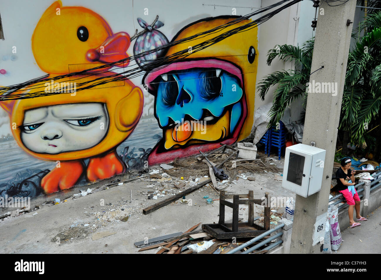 graffiti on the wall, expressionism and social messaging, weird and bizarre art, bangkok, thailand Stock Photo