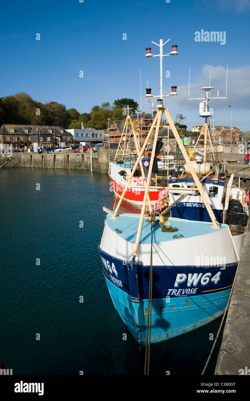 Cornish fishing boats / boat moored at the quay / quayside / harbor wall / in the harbour at Padstow. Cornwall. UK Stock Photo