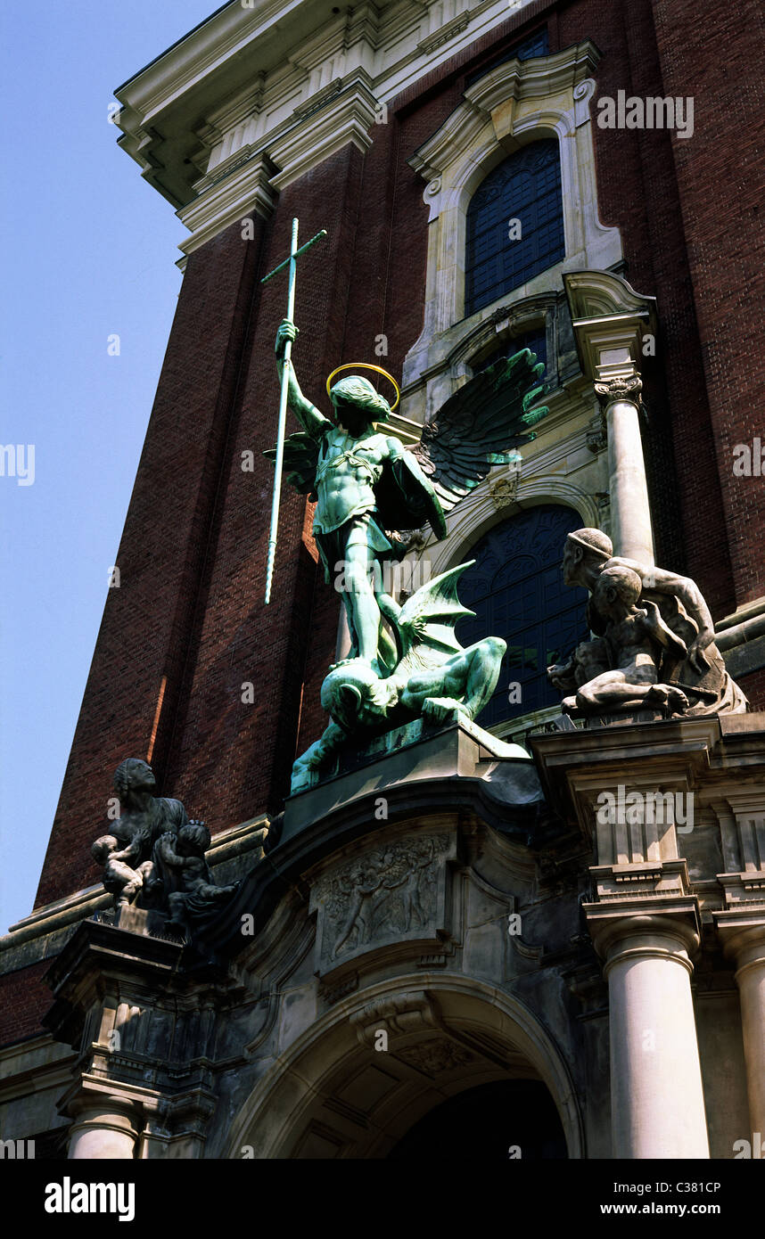 Höllensturz (War in Heaven) depiction above the main portal of Sankt Michaelis church in the German city of Hamburg. Stock Photo