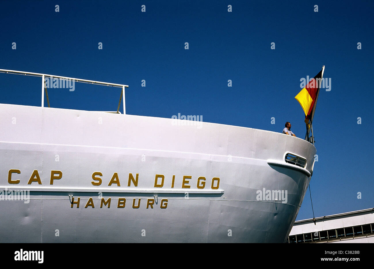 Visitor looking across the port of Hamburg on the rear deck of museum ship Cap San Diego at Überseebrücke. Stock Photo