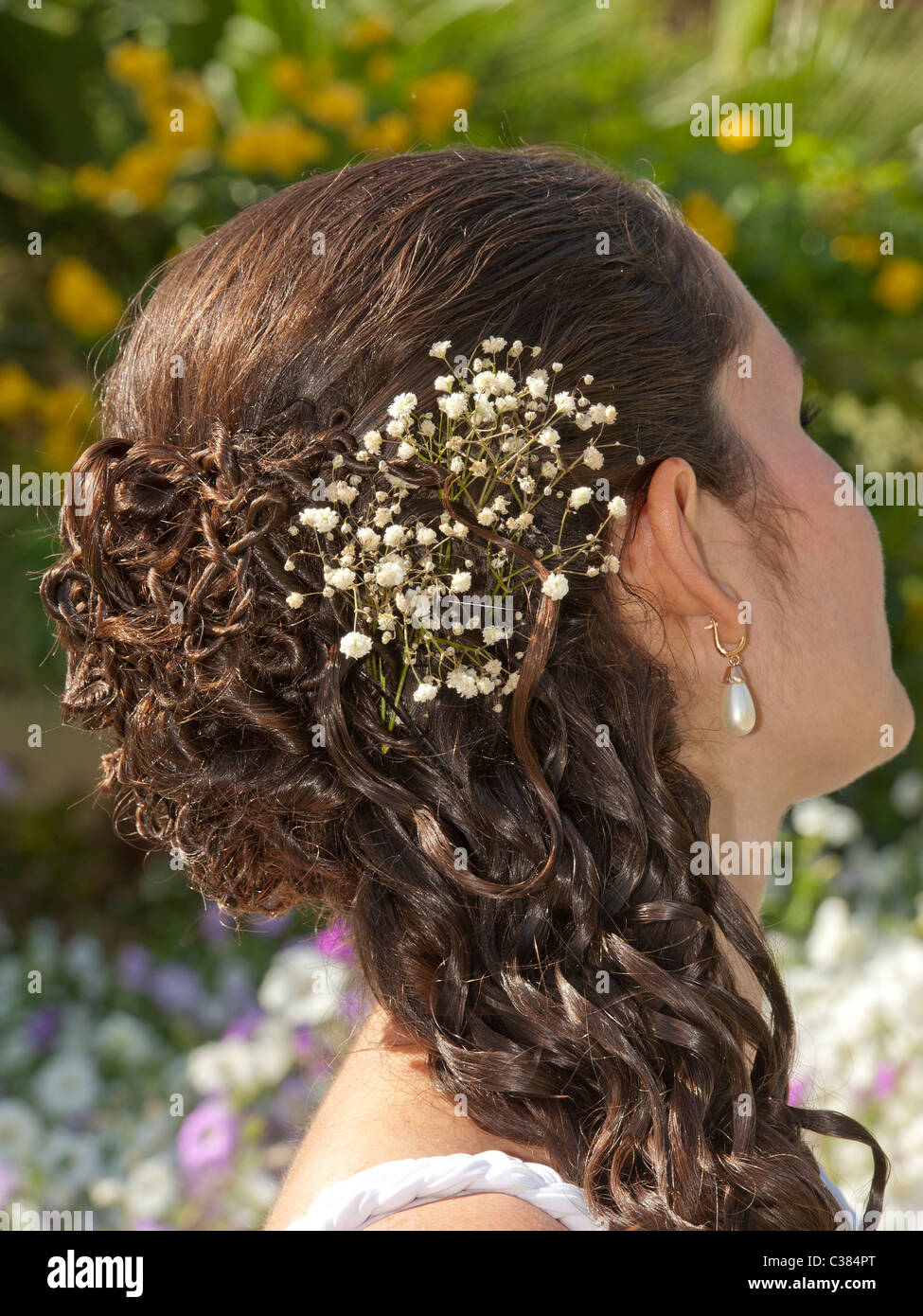 Ornate hair style with decoration on the head of a bride Stock Photo - Alamy