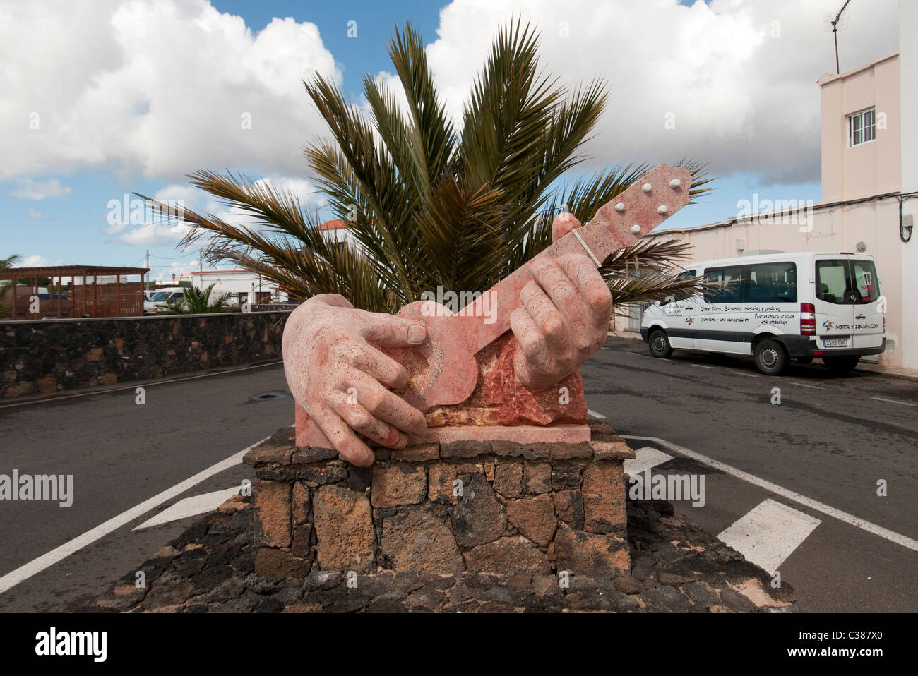clay statue of hands playing the guitar Lajares Fuerteventura Canary Islands Stock Photo