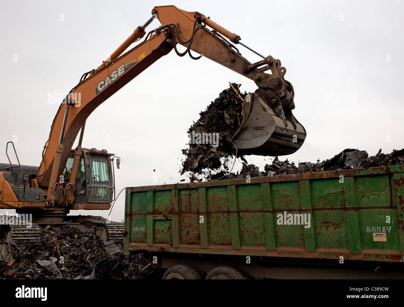 JCB fills trailer on landfill site in England Stock Photo