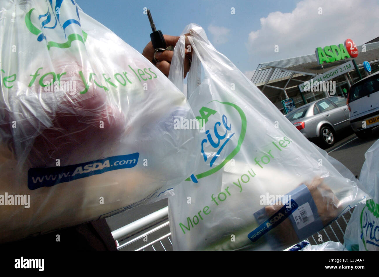 People carrying their shopping from Asda Walmart store in North London Stock Photo