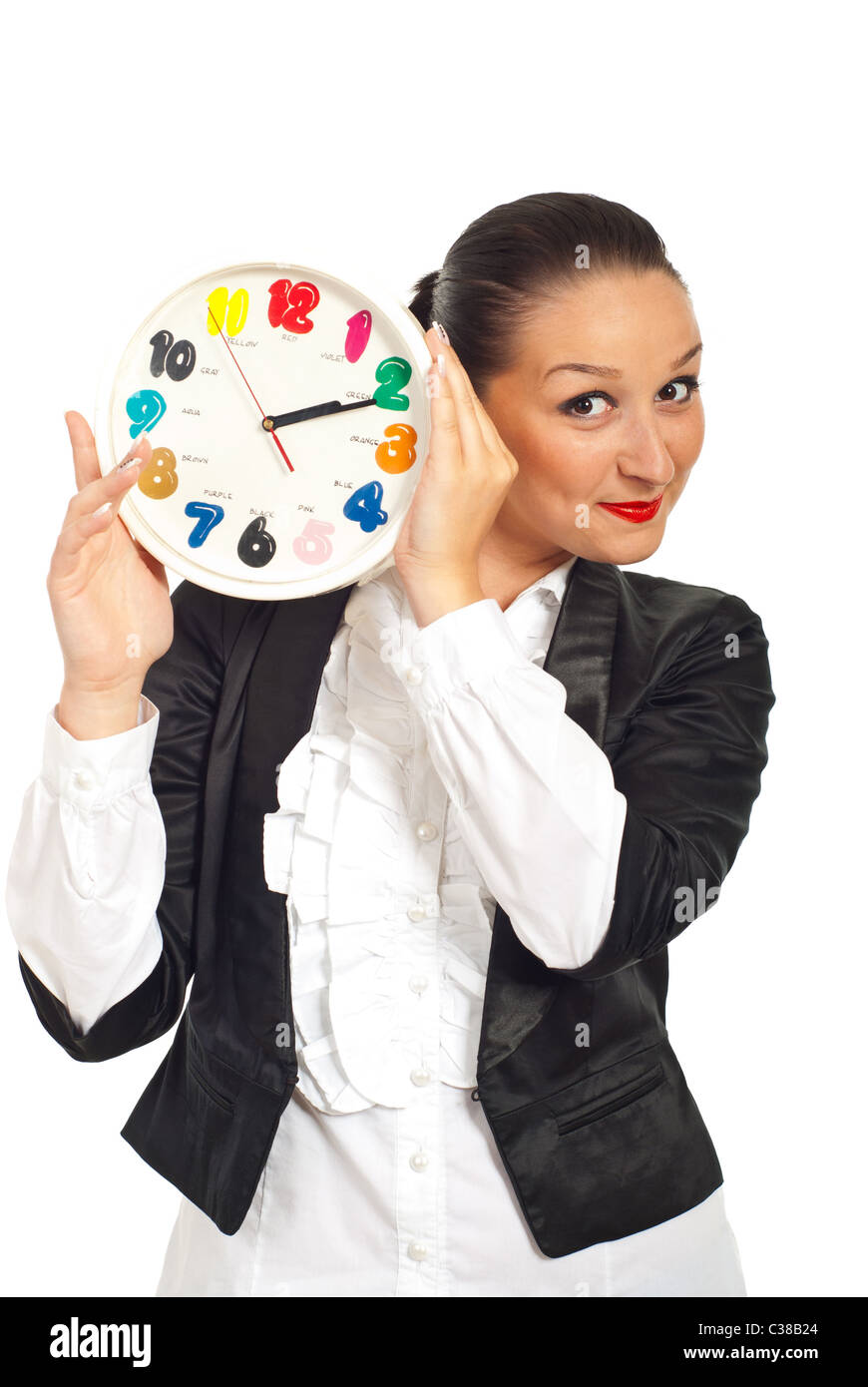 Business woman smiling behind clock with colorful numbers isolated on