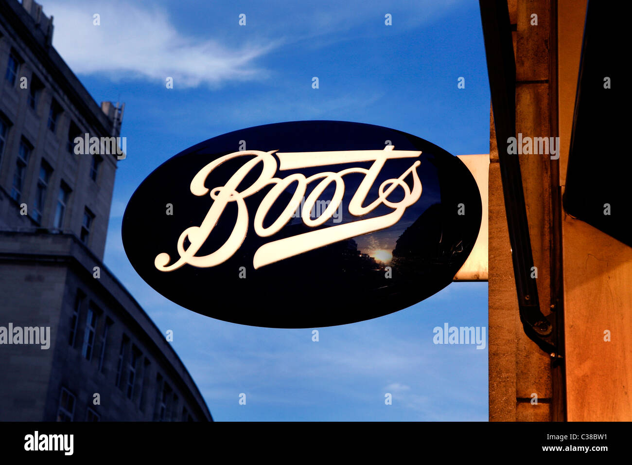 A Boots store sign at dusk Stock Photo - Alamy