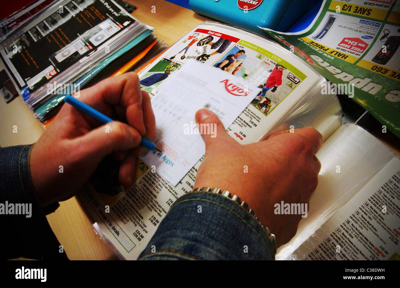 An Argos customer picking out the products she wants. Part of the Home ...
