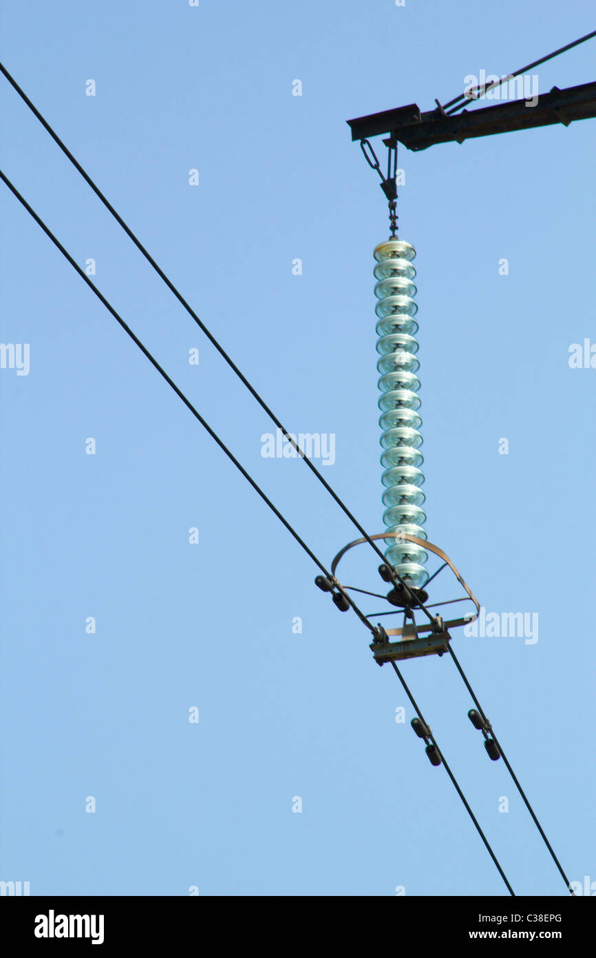 Power line against the blue sky Stock Photo - Alamy