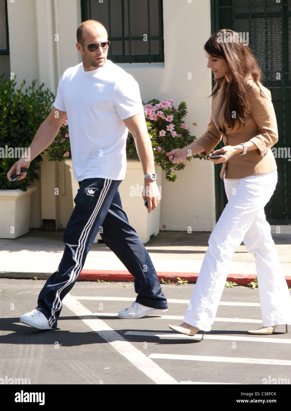 Jason Statham leaving Cafe Med on Sunset Boulevard with a female companion  Los Angeles, California - 23.03.09 Stock Photo - Alamy