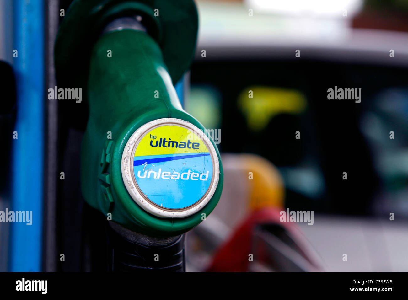 A BP Ultimate petrol pump with a refueled car in the background. Stock Photo