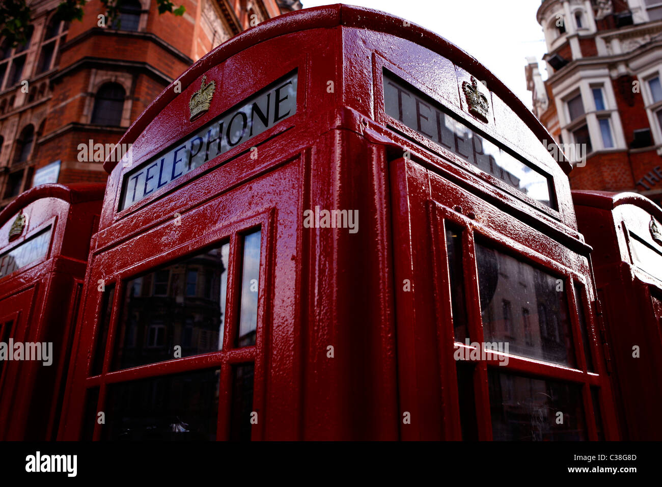 Four old-style red phone boxes in Central London. Stock Photo