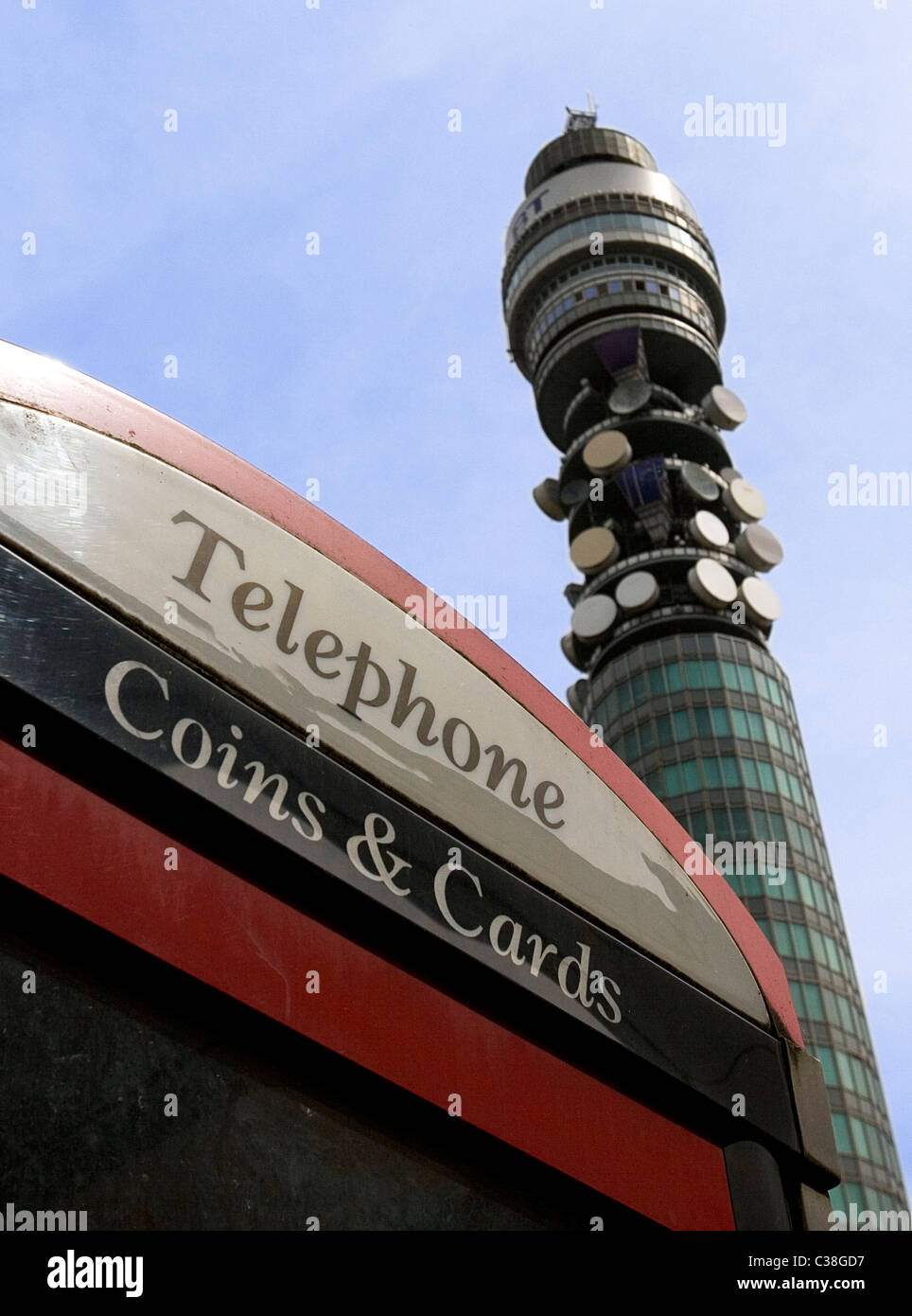 The BT Tower is visible behind a BT telephone booth in central London. Stock Photo