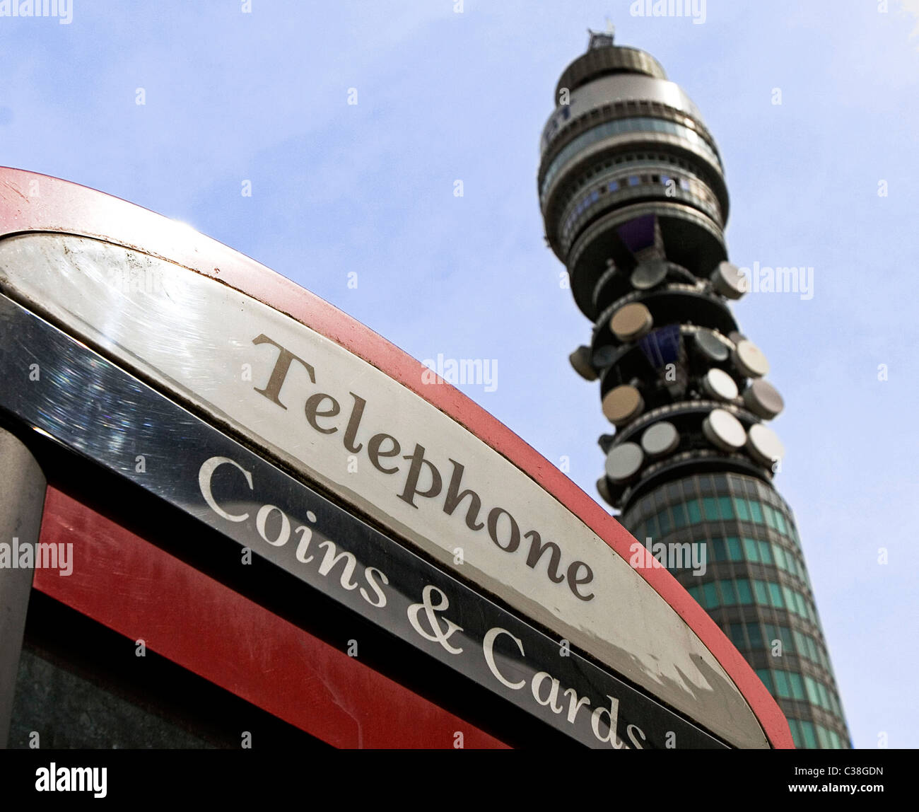 The BT Tower is visible behind a BT telephone booth in central London. Stock Photo