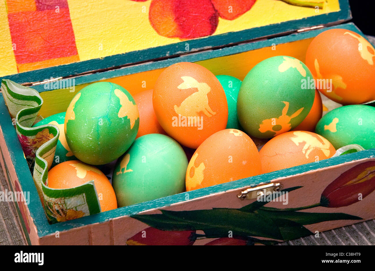 Many colorful ornamented eggs on decorated box, Easter theme Stock Photo