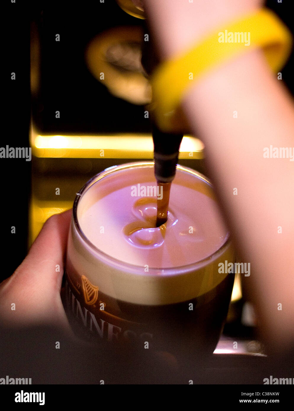 A pint of Guinness being pulled in Tully's Hotel Bar, Castlerea, County Roscommon, Ireland. Stock Photo