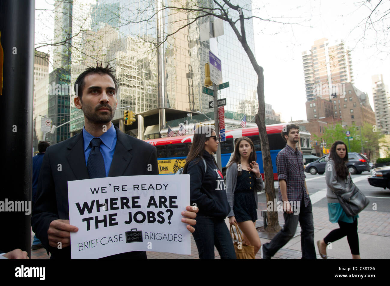 Members of the Briefcase Brigades and their supporters protest in front