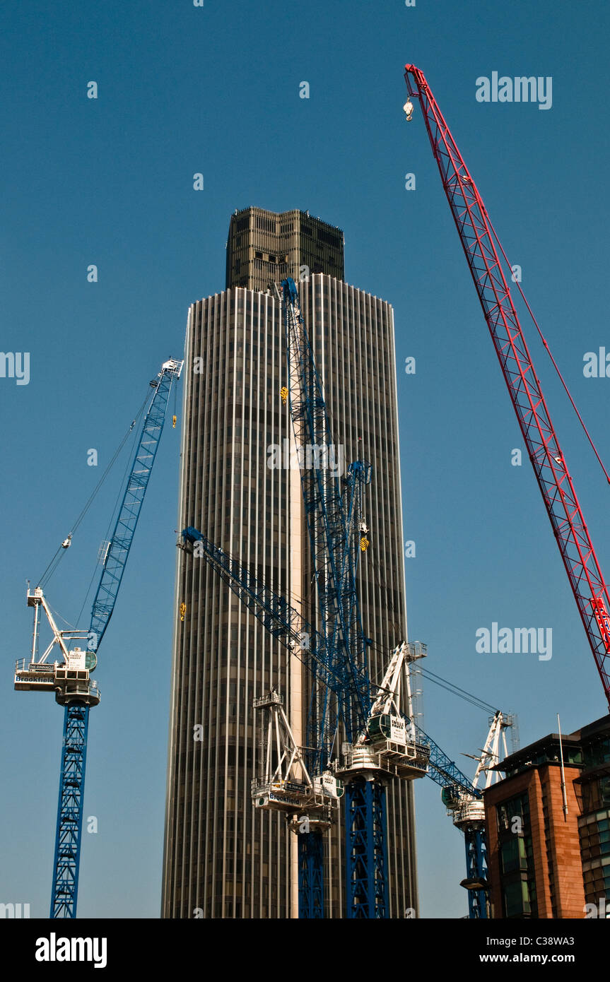 Tower 42, NatWest tower and cranes, City of London, UK Stock Photo