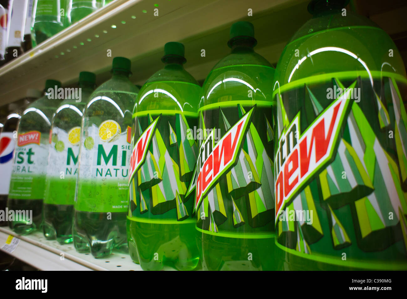 Bottles of Mountain Dew and other brands of soda are seen on a