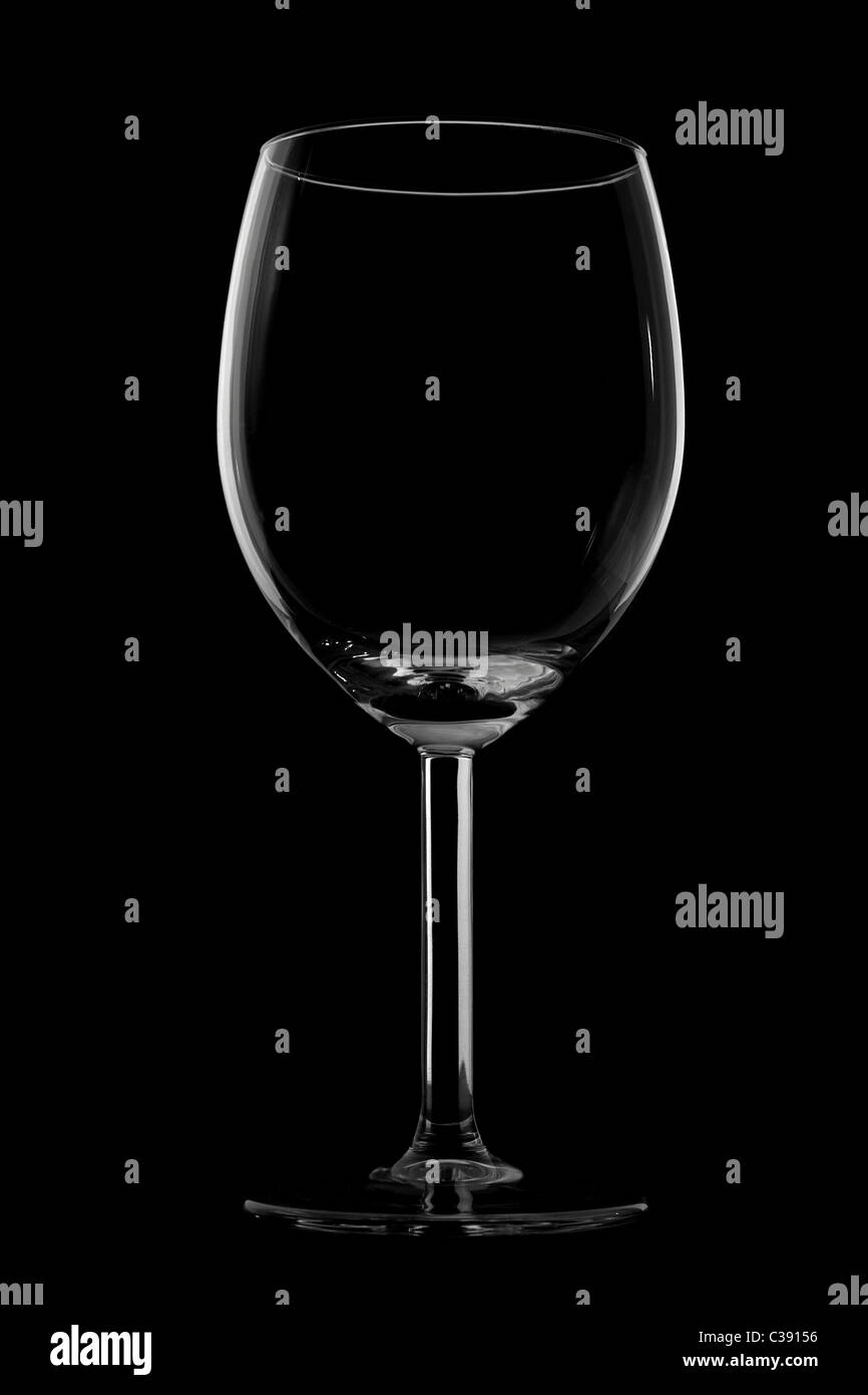 Silhouette of red wine glass isolated on black Stock Photo
