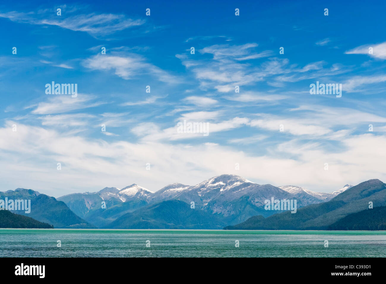 Rare sunny view of coastal mountains and Tongass National Forest in Gilbert Bay in the Inside Passage of Southeast Alaska. Stock Photo