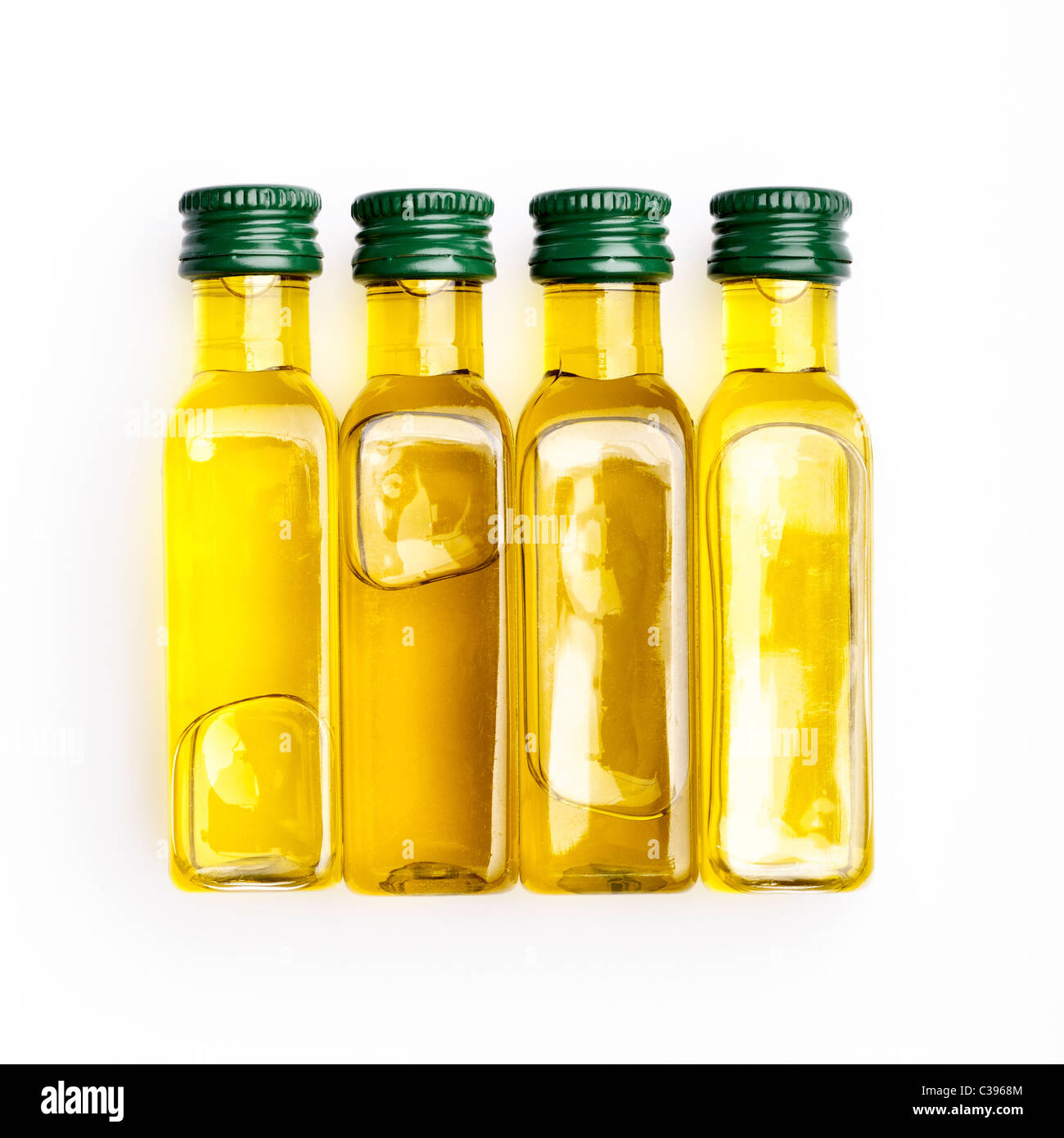 Four bottles of extra virgin olive oil Stock Photo - Alamy