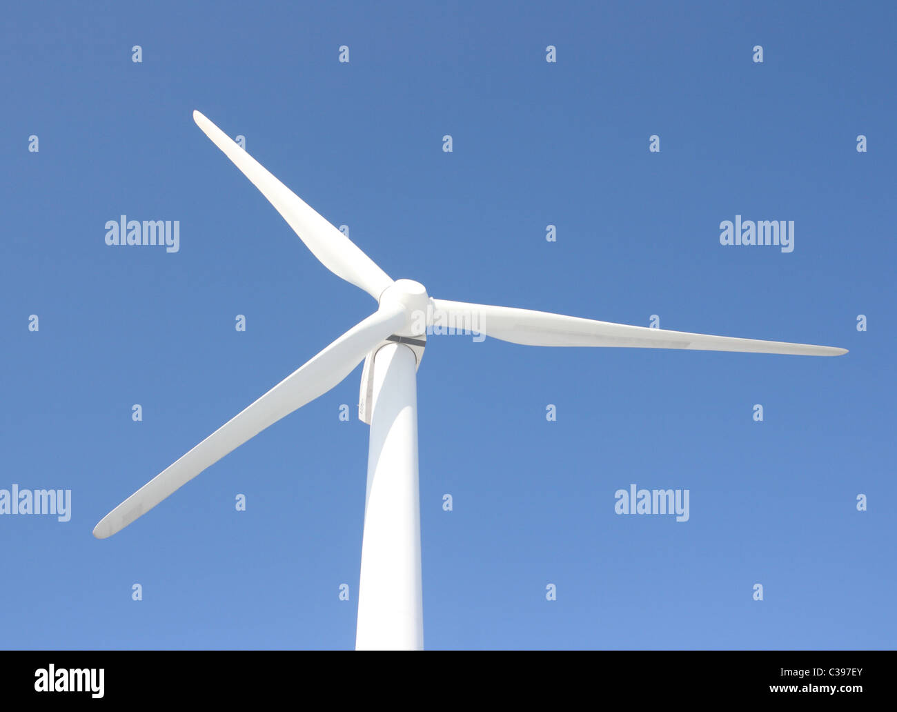View of single windmill generating electricity against blue sky Stock ...