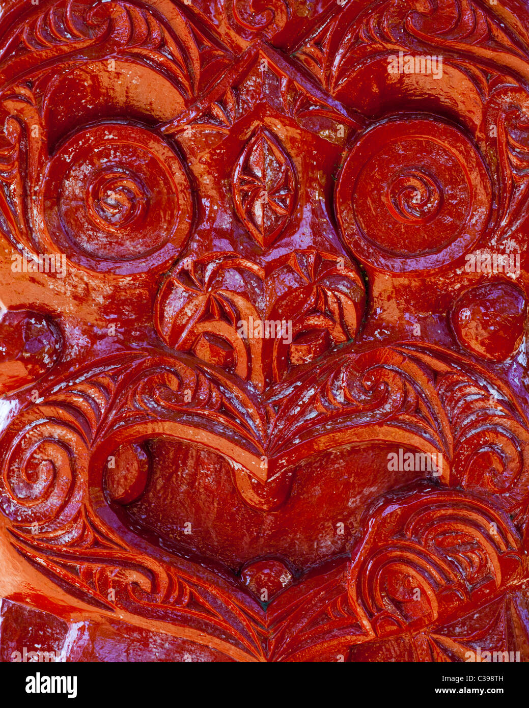 A Red Maori Wood Carving Stock Photo