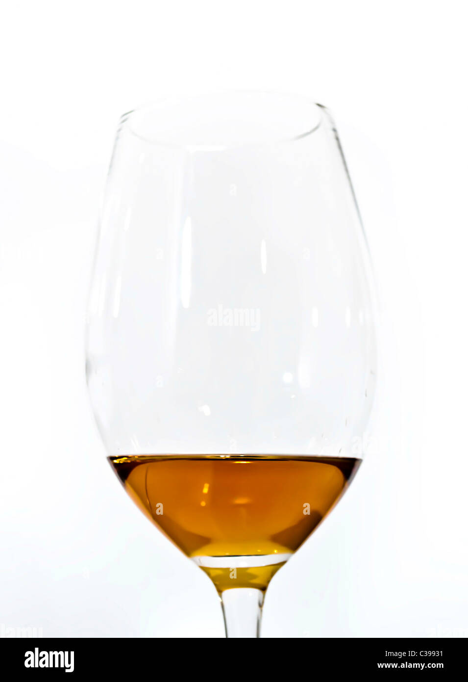 Brown whisky melted glass on white background Stock Photo