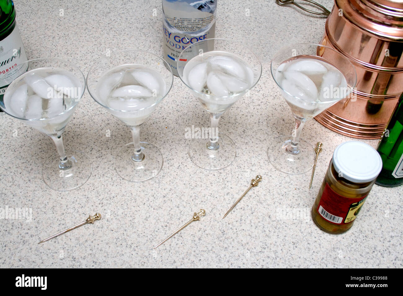 Four Martini stemmed glasses in process and ready to drink. St Paul Minnesota MN USA Stock Photo