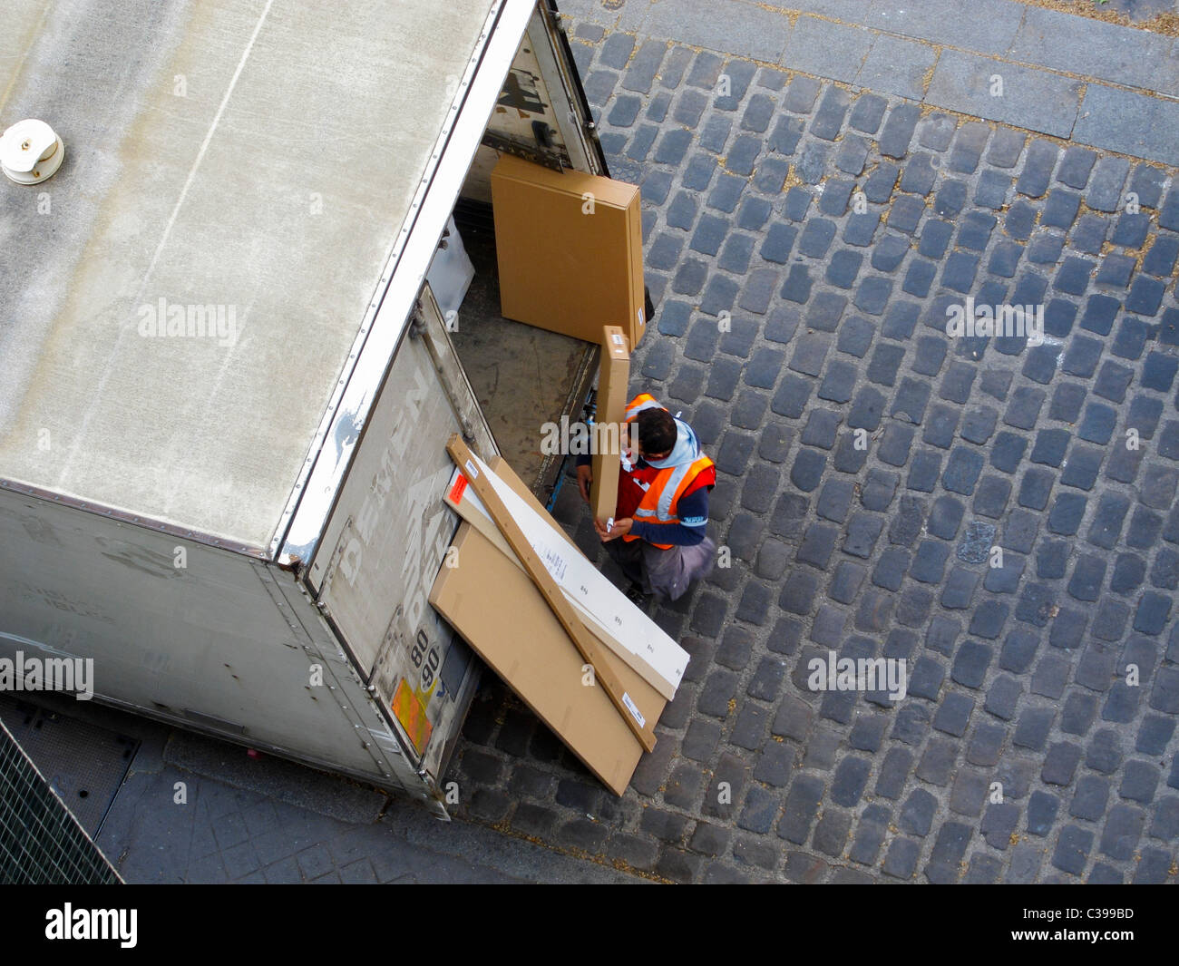 Paris, France, Man Delivering Packages from Back of French Delivery