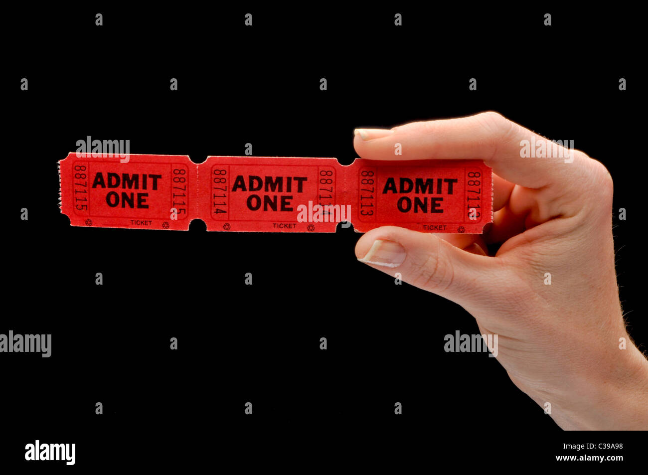 hand holding red movie theatre tickets Stock Photo