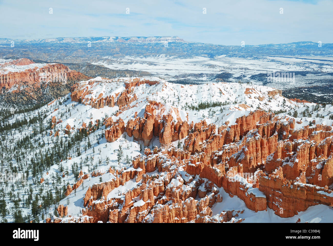 Bryce canyon panorama with snow in Winter with red rocks and blue sky
