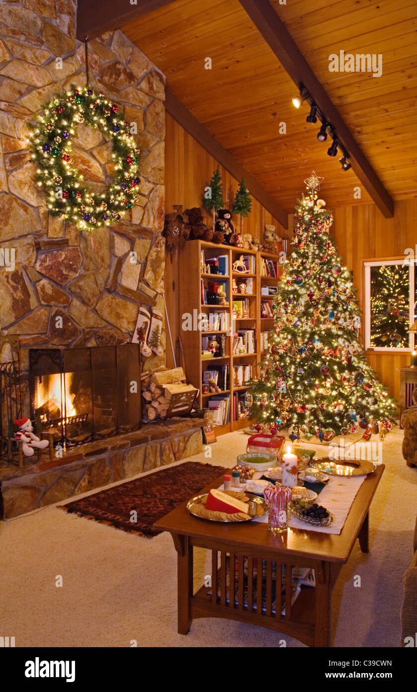 Christmas tree and holiday decor ready for a party in family room of house. Stock Photo