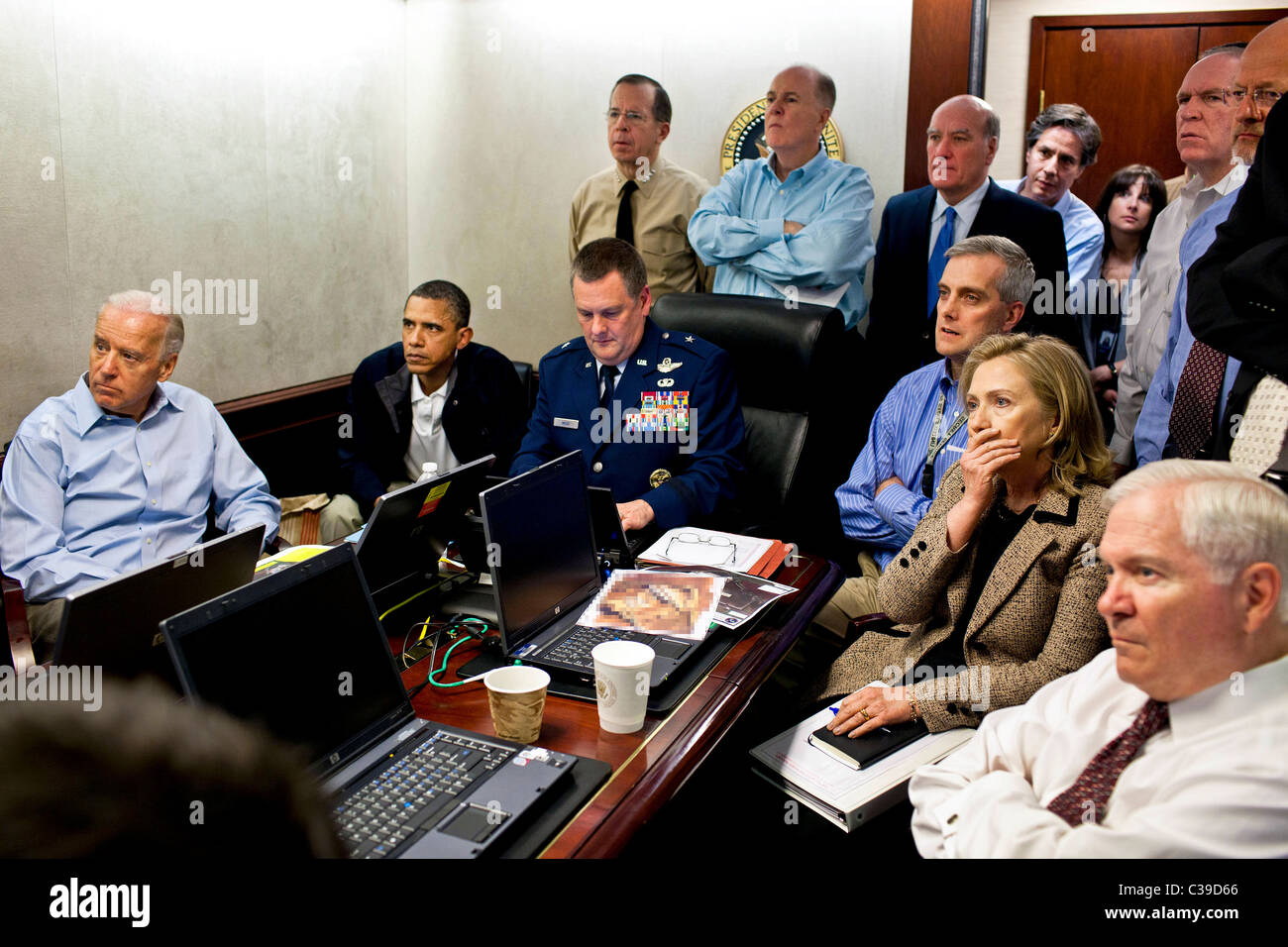 President Barack Obama and Vice President Joe Biden, along with with members of the national security team, receive an update on Stock Photo