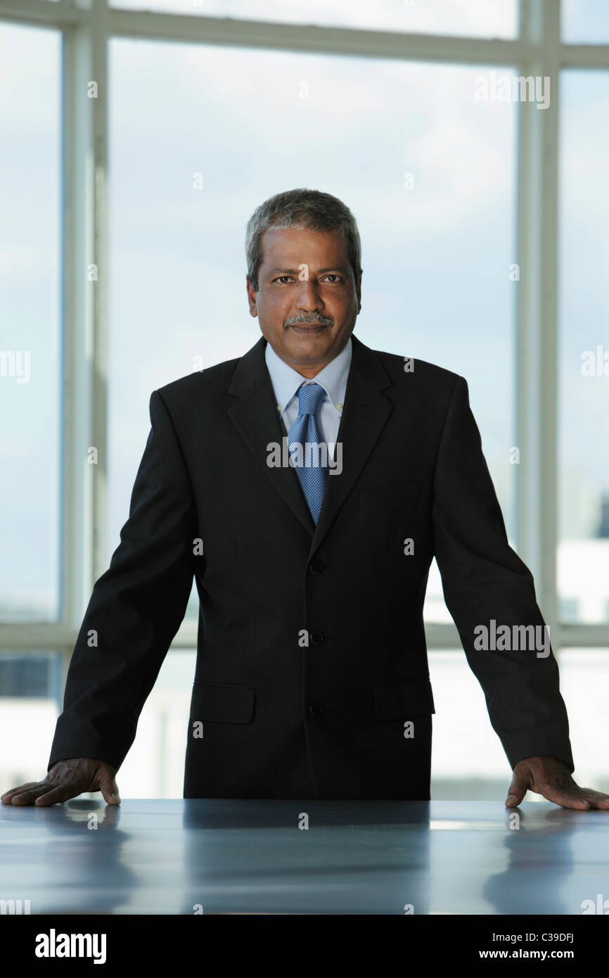 Indian man standing grey hi-res stock photography and images - Alamy