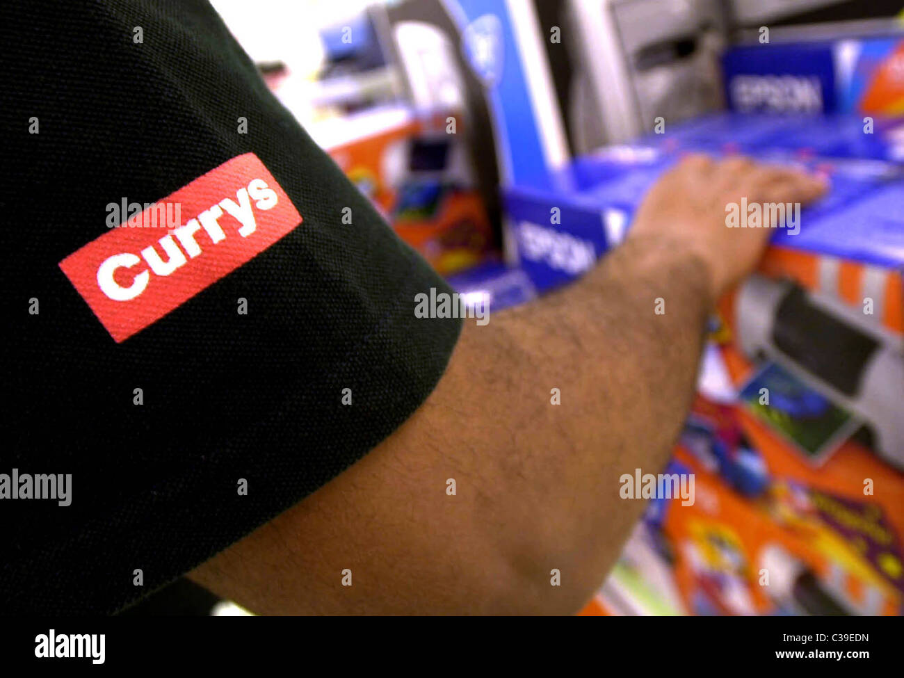 Picture shows a Currys employee carrying out a stock check Stock Photo