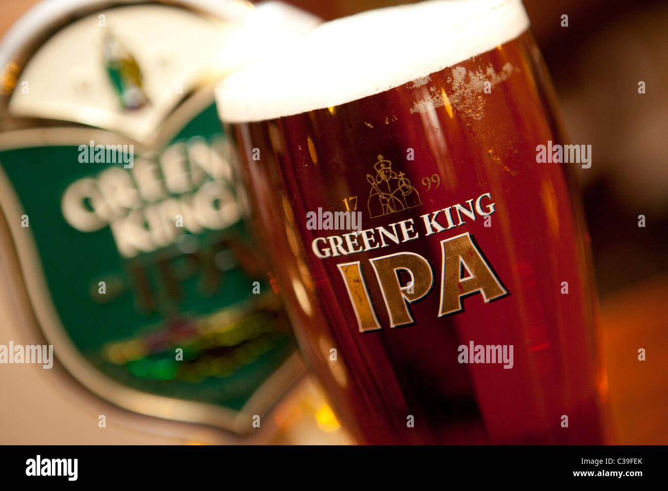 A pint of Greene King IPA in a branded glass. Stock Photo