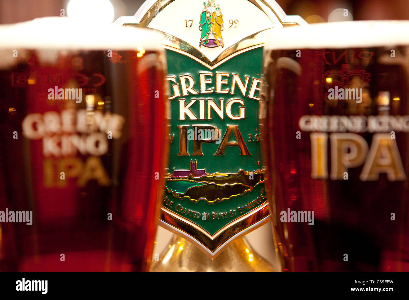 Two pints of Greene King IPA in branded glasses. Stock Photo