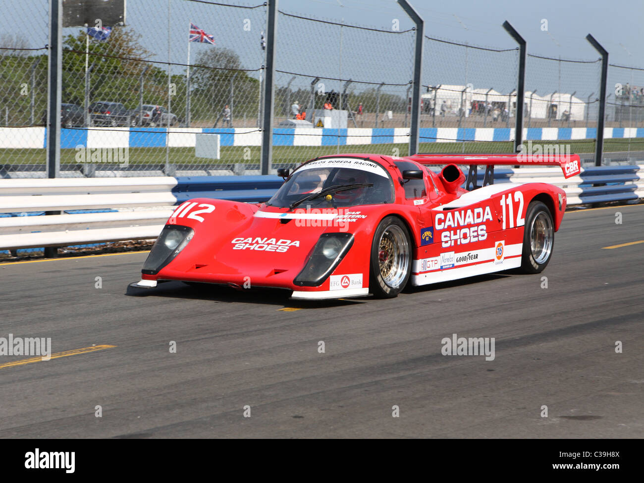 Group C sports cars in the pit lane at the Donington Historic Festival 2011 Stock Photo