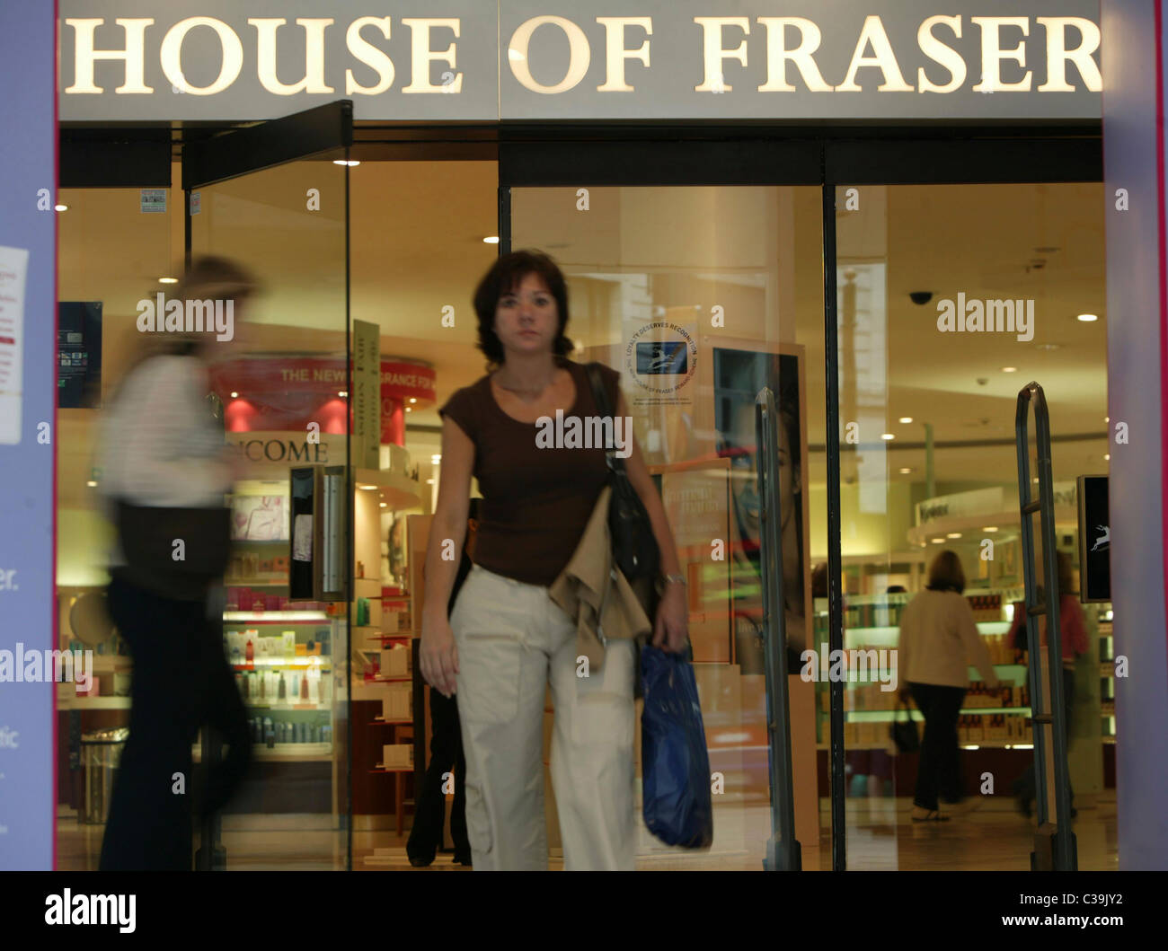 Customers leaving a House of Fraser store Stock Photo - Alamy