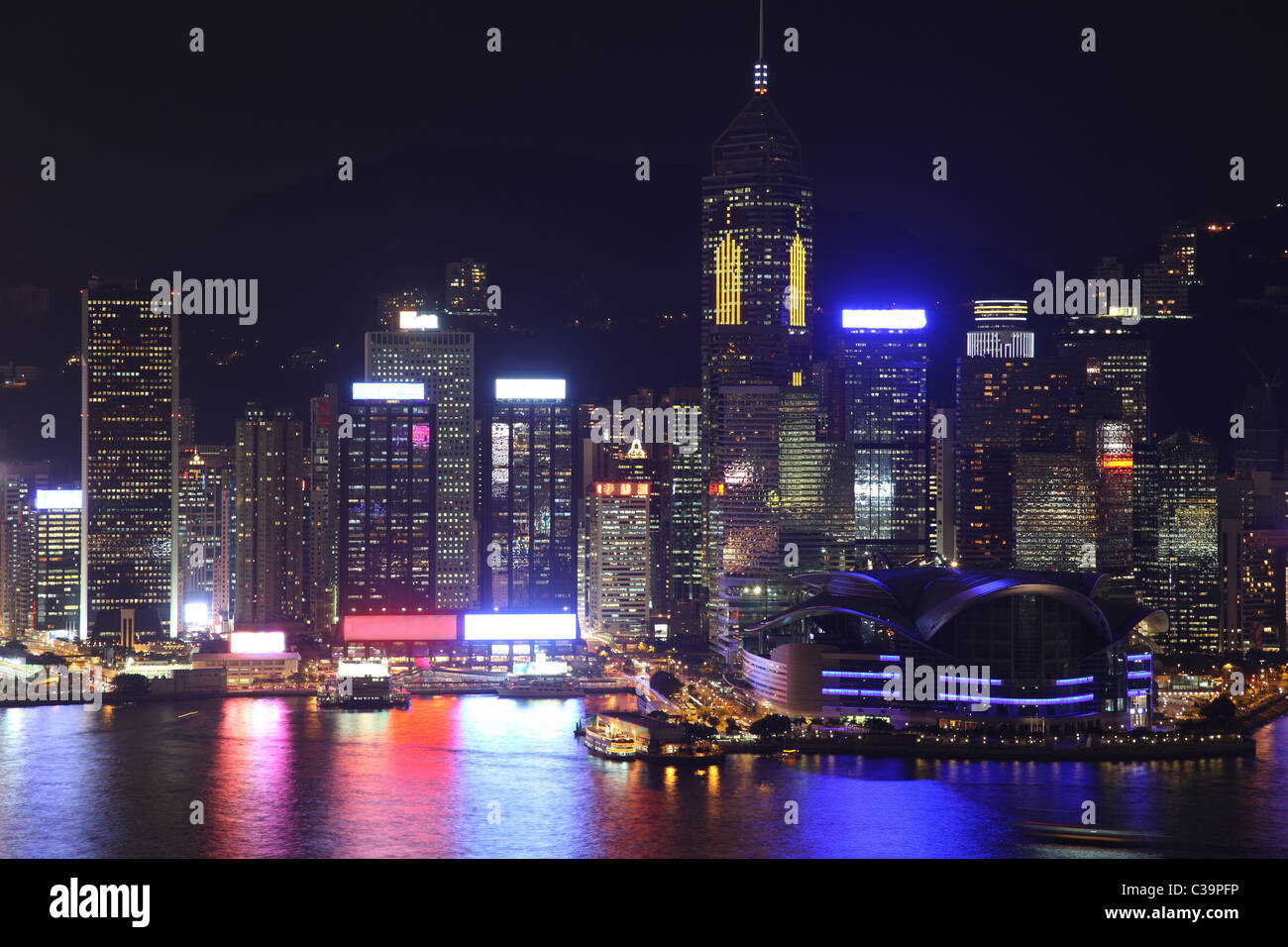 Illuminated Hong Kong Island skyline with reflections at night Stock ...